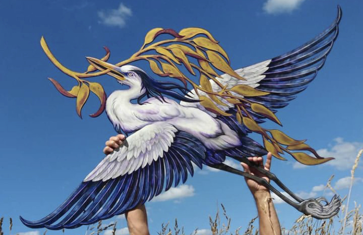 Hand painted wood cut out Flying Heron with gold foliage in white, blue, gold and purple. 